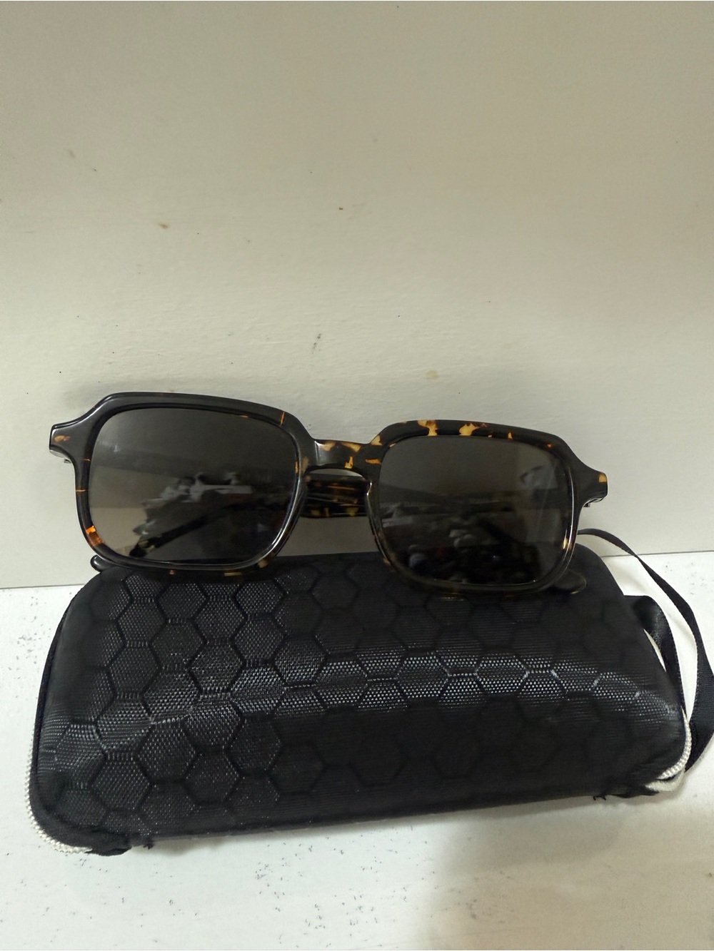 UMBERTO Italian artisan-made, tortoiseshell pattern frame with blue lens.